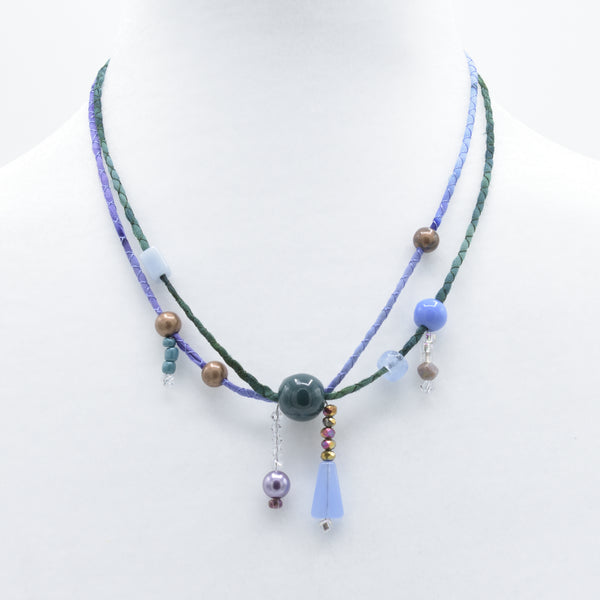 artisan hand crafted short necklace with hand sewn cords from cotton batik fabric embellished with crystals and beads