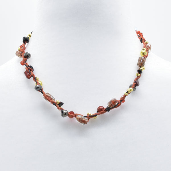 artisan hand crafted short with a cord sewn from cotton batik fabric braided with cords embellished with crystals and beads