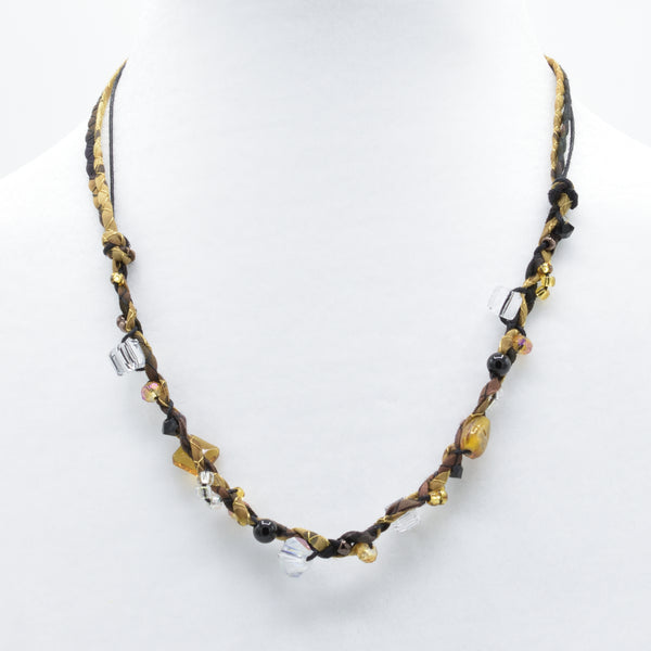 artisan hand crafted mid necklace with hand sewn cords from cotton batik fabric embellished with crystals and beads