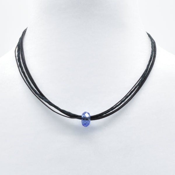 artisan hand crafted short necklace with a strand sewn from cotton batik fabric added with 5 cotton cords adorned with a crystal slide