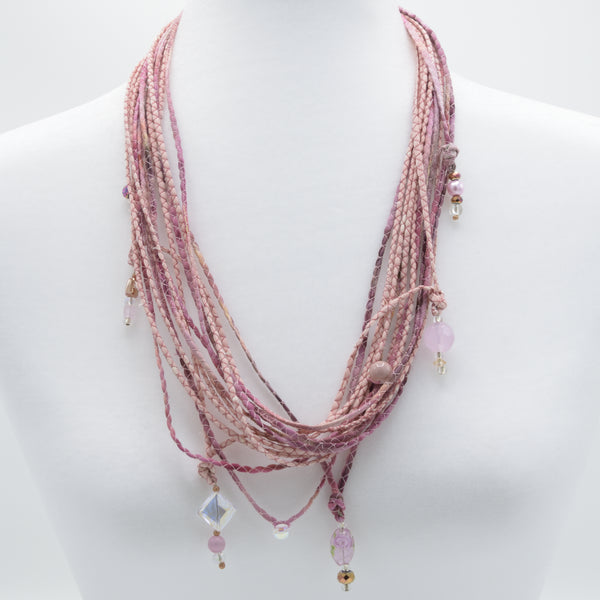 artisan hand crafted long necklace with 14 cords hand sewn from cotton batik fabric adorned with crystals and beads