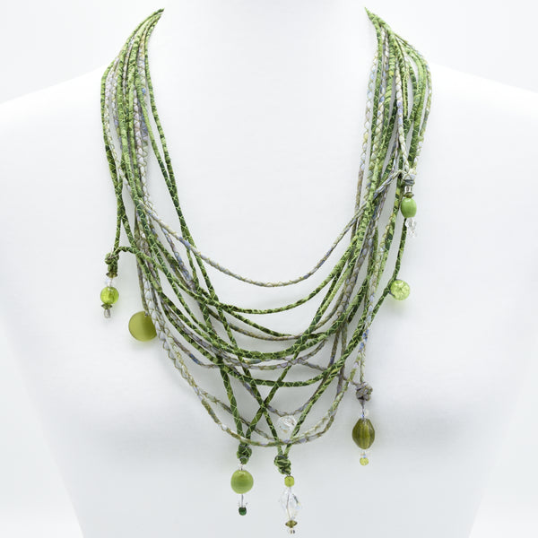 artisan hand crafted long necklace with 14 cords hand sewn from cotton batik fabric adorned with crystals and beads