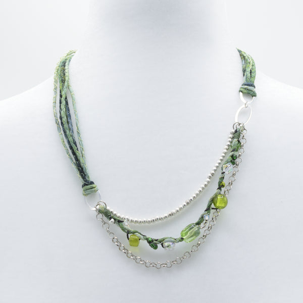 artisan hand crafted short necklace with a cords sewn from cotton batik fabric with a silver link to strung crystals and beads